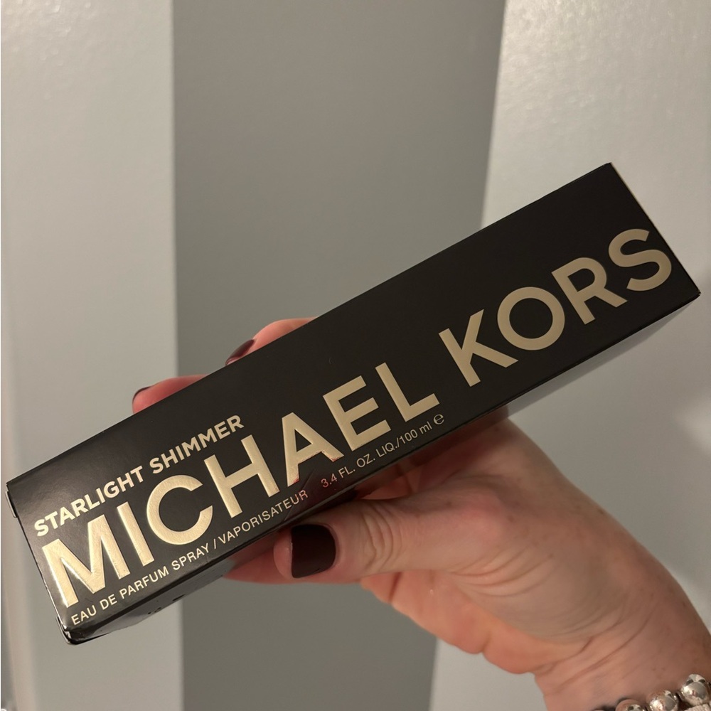 Brand new 3.4 oz bottle of Michael Kors Starlight Shimmer.